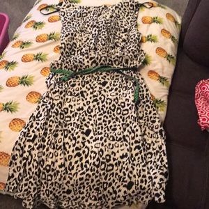 Black and white print dress with green belt